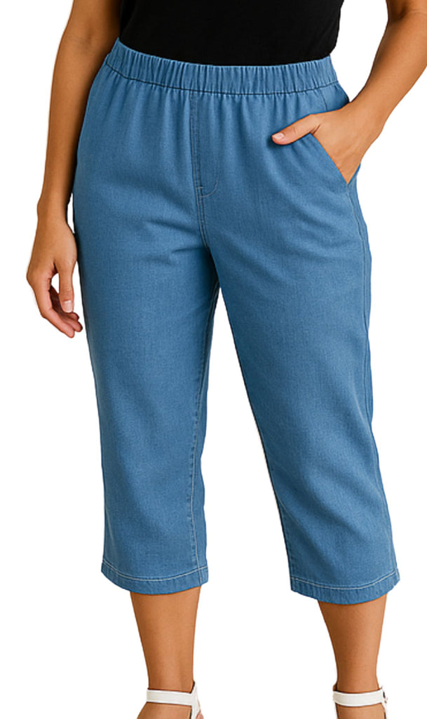 Blue denim capri pants worn by a person on a white background